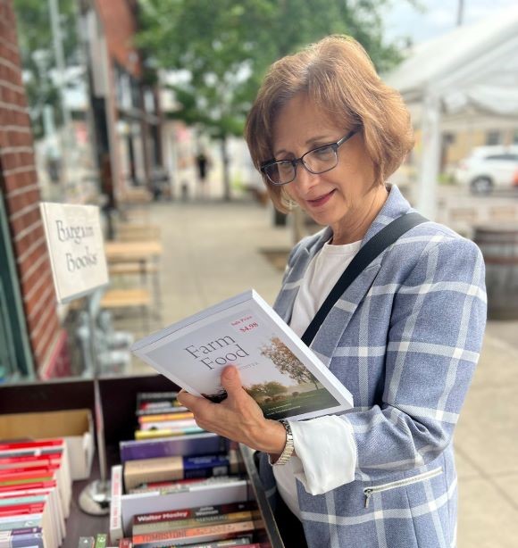 Suzanne looking at a book